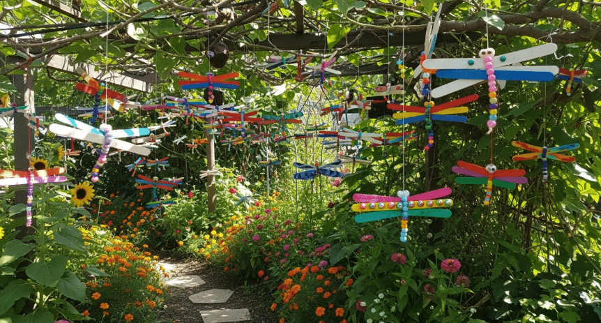Decorating Your Garden with Hanging Dragonflies Decorated garden with hanging dragonflies created by kids.