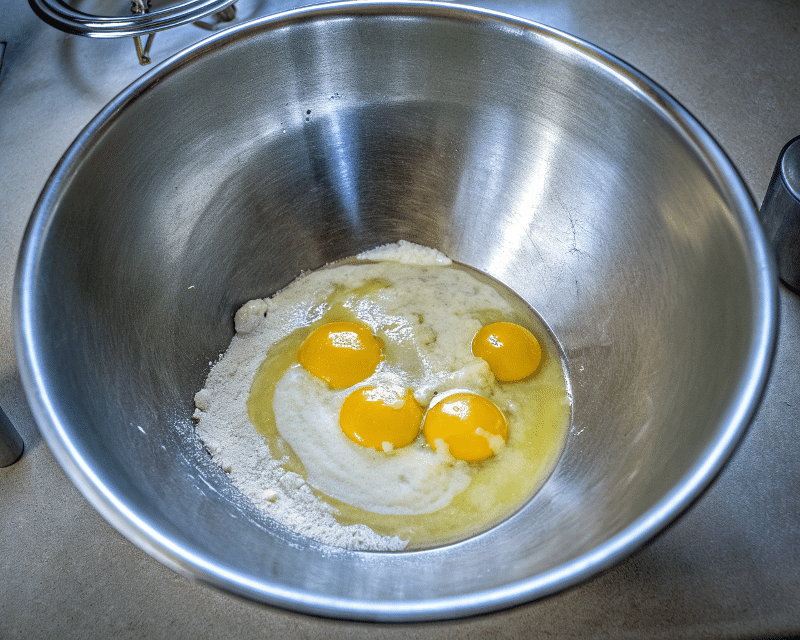 Mix the Ingredients A large bowl, mixing the melted butter and sugar and the eggs.