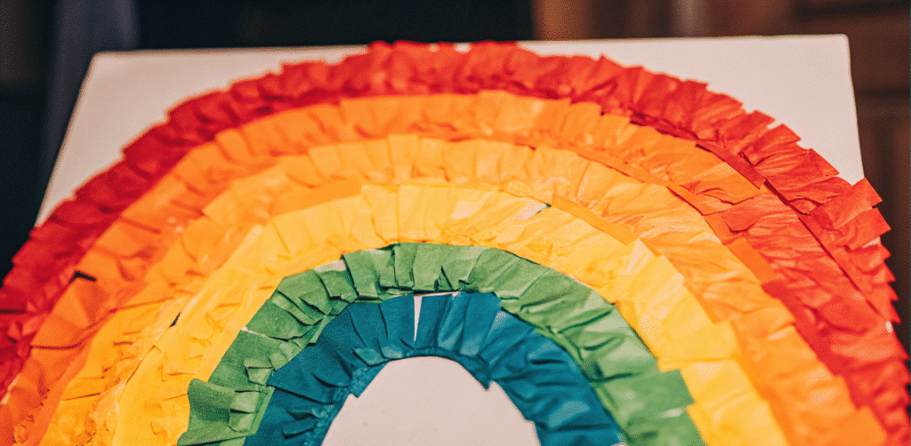 Tissue Paper Rainbow Collage A colorful tissue paper rainbow collage created by kids.