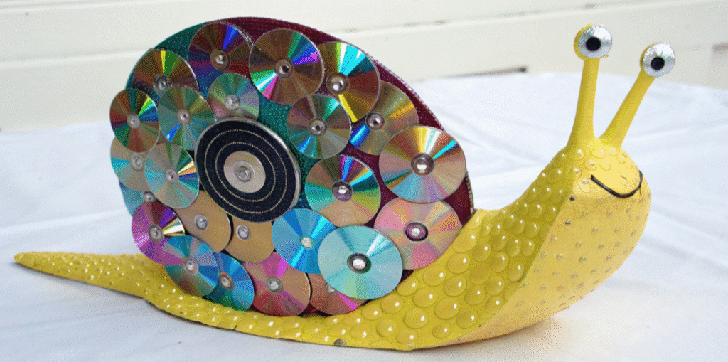 Using Old CDs for Snail Crafts Using old CDs to create a unique snail craft, perfect for kids.
