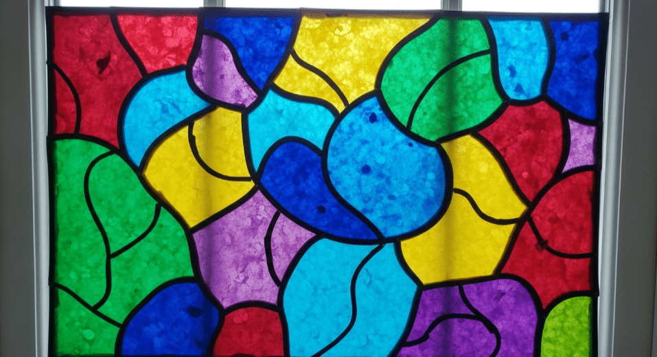 Wax Paper Stained Glass Art A colorful wax paper stained glass art project showcasing vibrant colors.