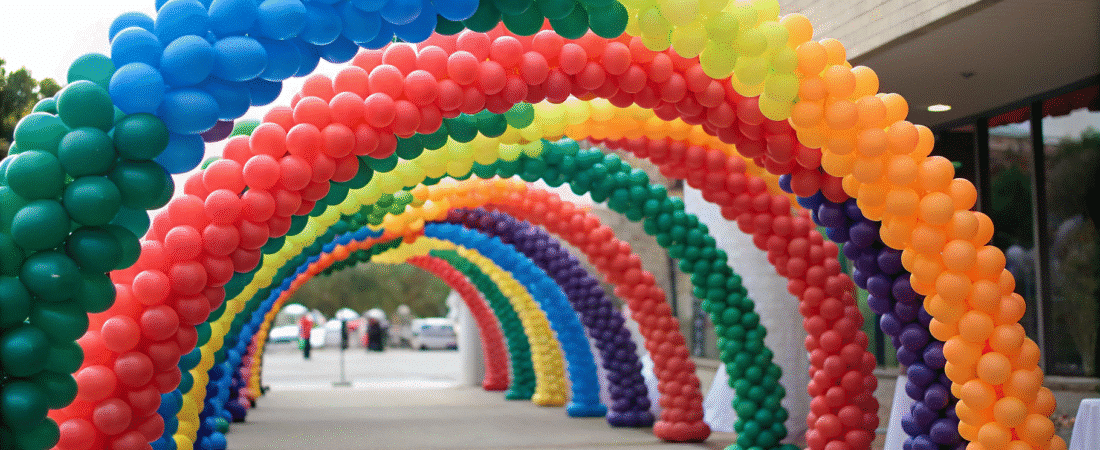 Different colored balloon arches outdoor.