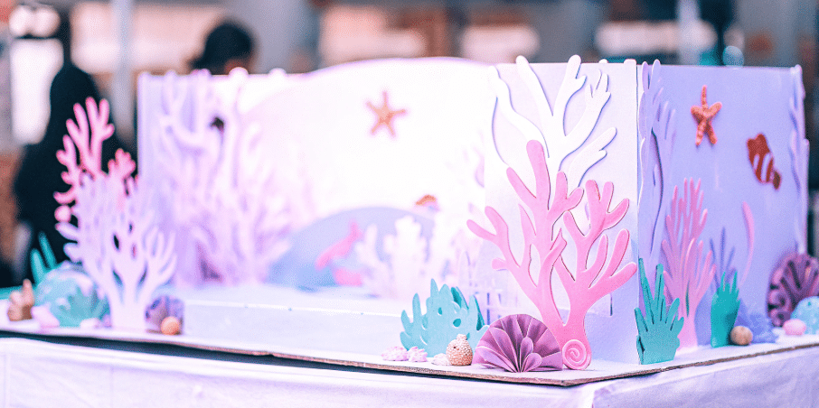 A colorful coral reef craft made from various materials.