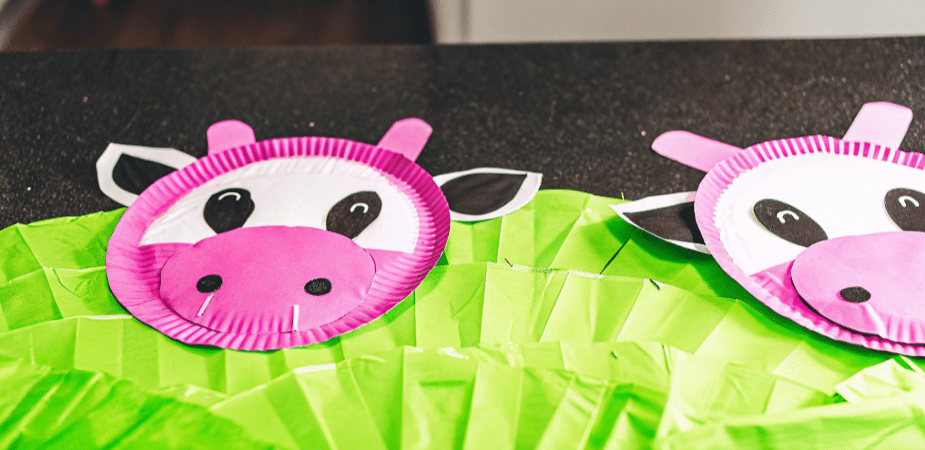 Creating a Paper Plate Cow Craft A colorful paper plate cow craft displayed on a table.