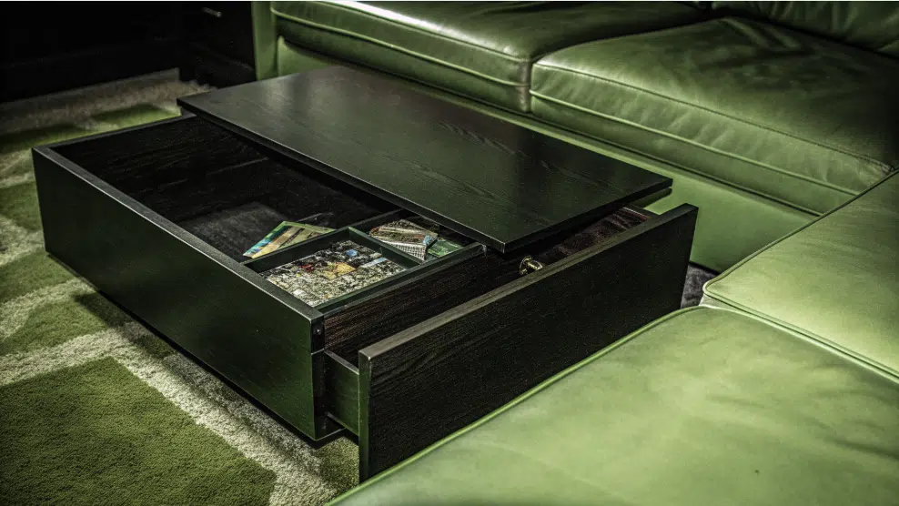 DIY coffee table designed with hidden puzzle storage, a clever space-saving solution.