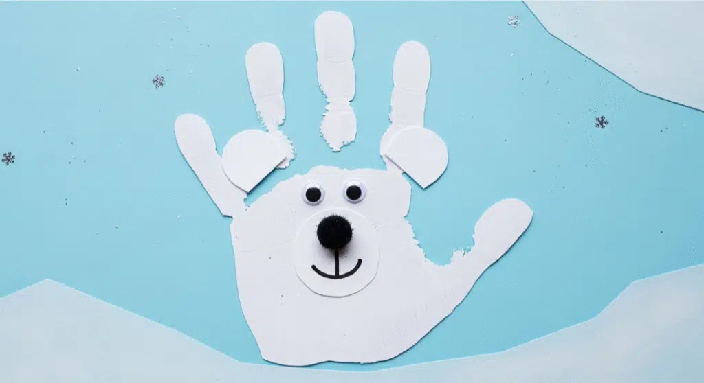 A child's handprint transformed into a cute polar bear craft.
