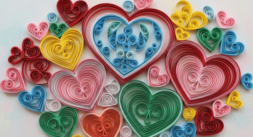 Quilled Paper Hearts An artistic arrangement of quilled paper hearts in different colors and sizes.