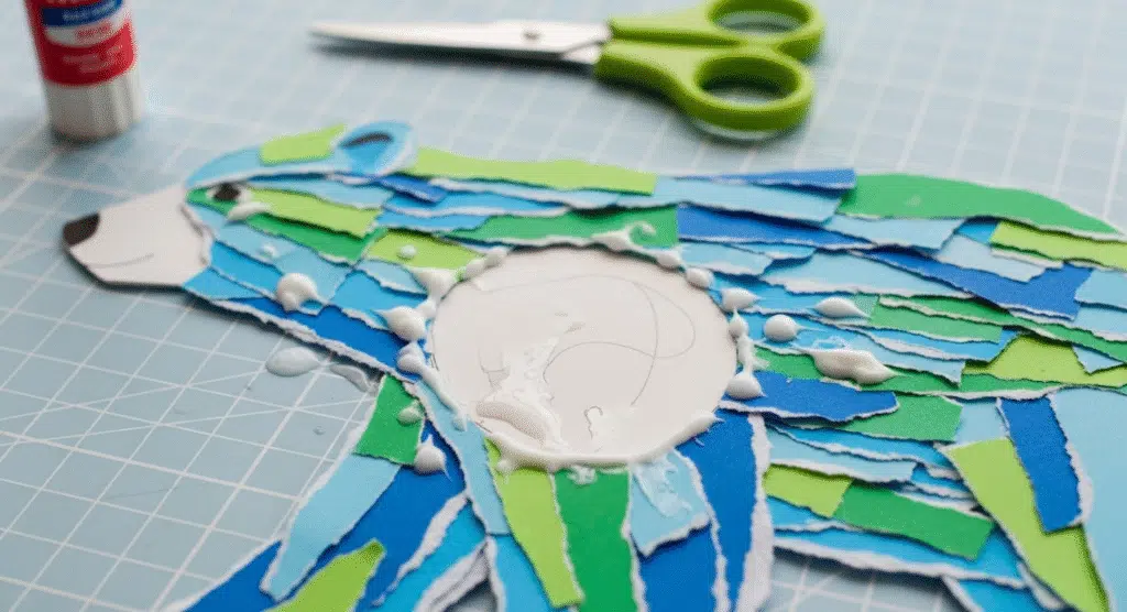 A colorful Ripped Paper Polar Bear Craft in progress.