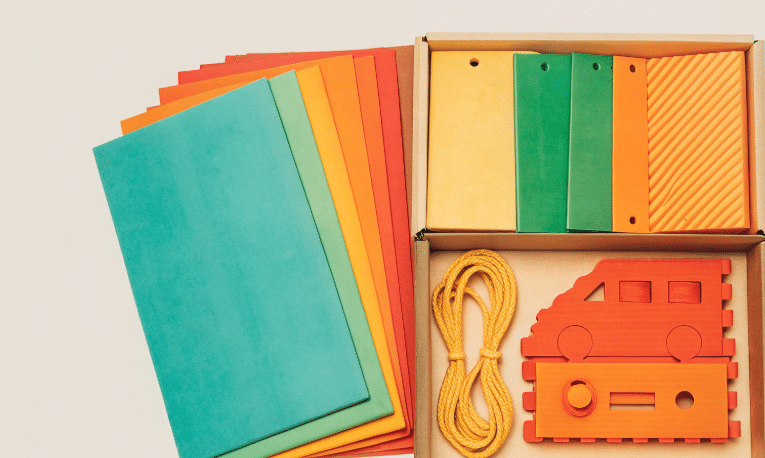 The image features a beautifully packaged DIY kit designed for building a wooden remote-control car, complete with all necessary materials and easy-to-follow instructions. This gift set is perfect for hobbyists and kids alike, offering a fun and engaging craft experience.