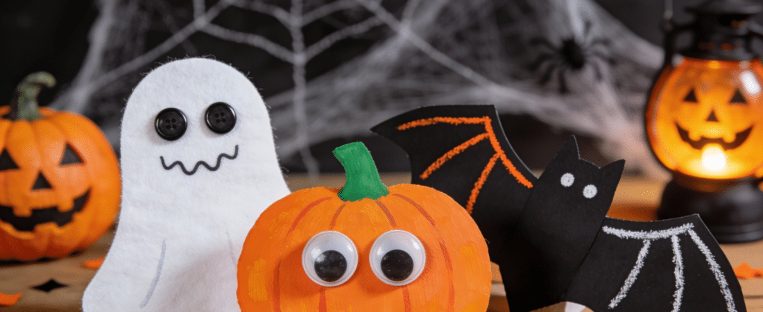 Childrens Crafts for Halloween Different halloween crafts on a table.