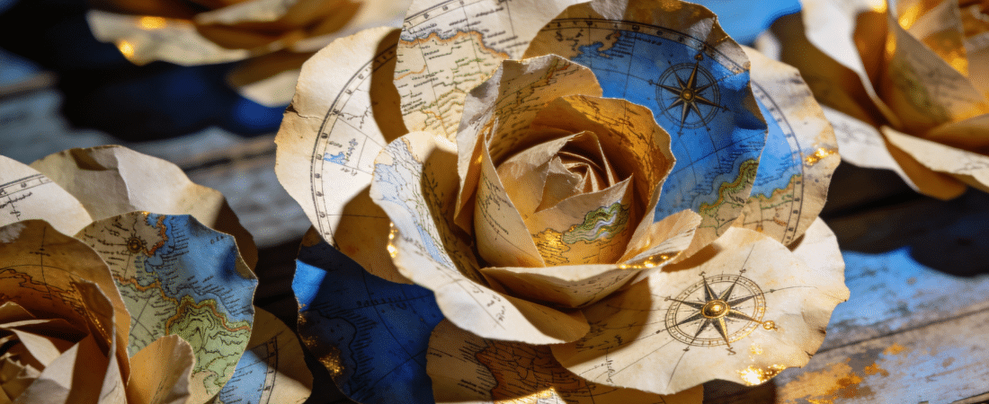 A map paper flower on a blue table.
