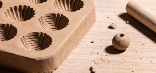 A closeup image of a Clay Bead Mold.